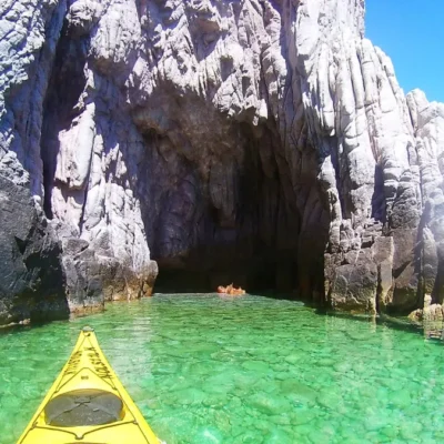 Exploring the rock formations of Baja California's costal cliffs while sea kayaking on Mexico's Sea of Cortez (Gulf of California).