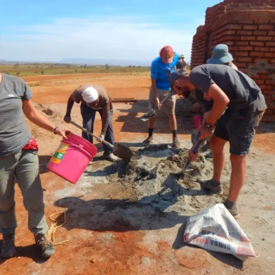 Students renovate a toilet block as part of a homestay project in Karatu, Tanzania.