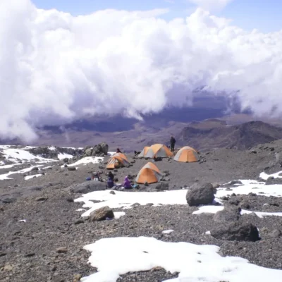 Group camp high up in the mountains while mountaineering in Tanzania.