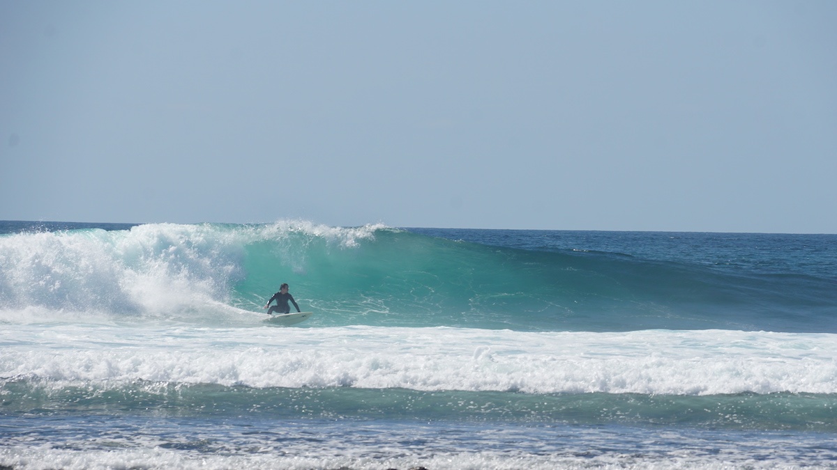 Surfer riding a wave in Baja California