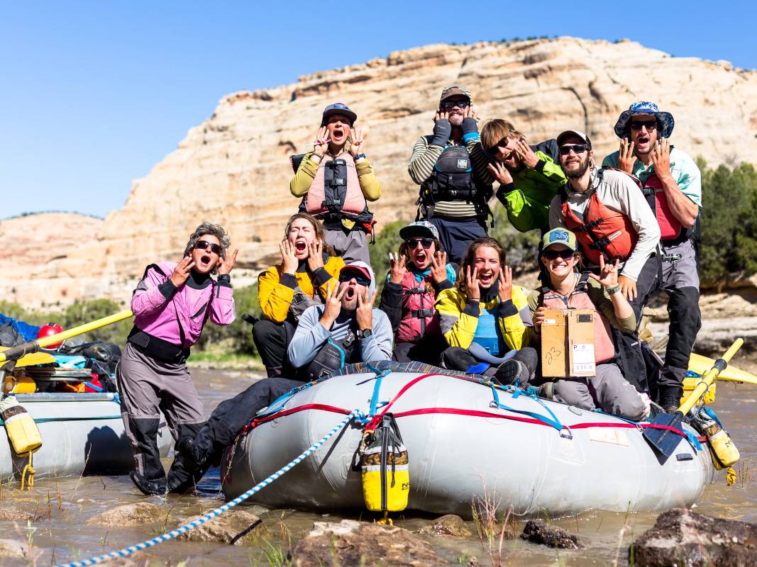 Happy group photo of Instructors on river rafts