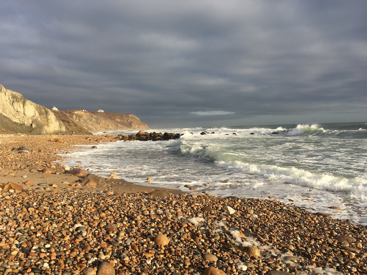 waves rolling in against a pebbly beach on Block Island