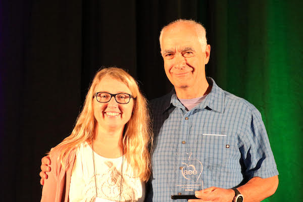 Joe Austin at 2018 Association for Experiential Education conference holding his Servant Leader Award