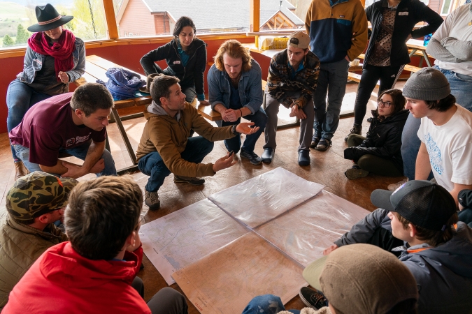 A group of gap year students engaged in a problem solving session