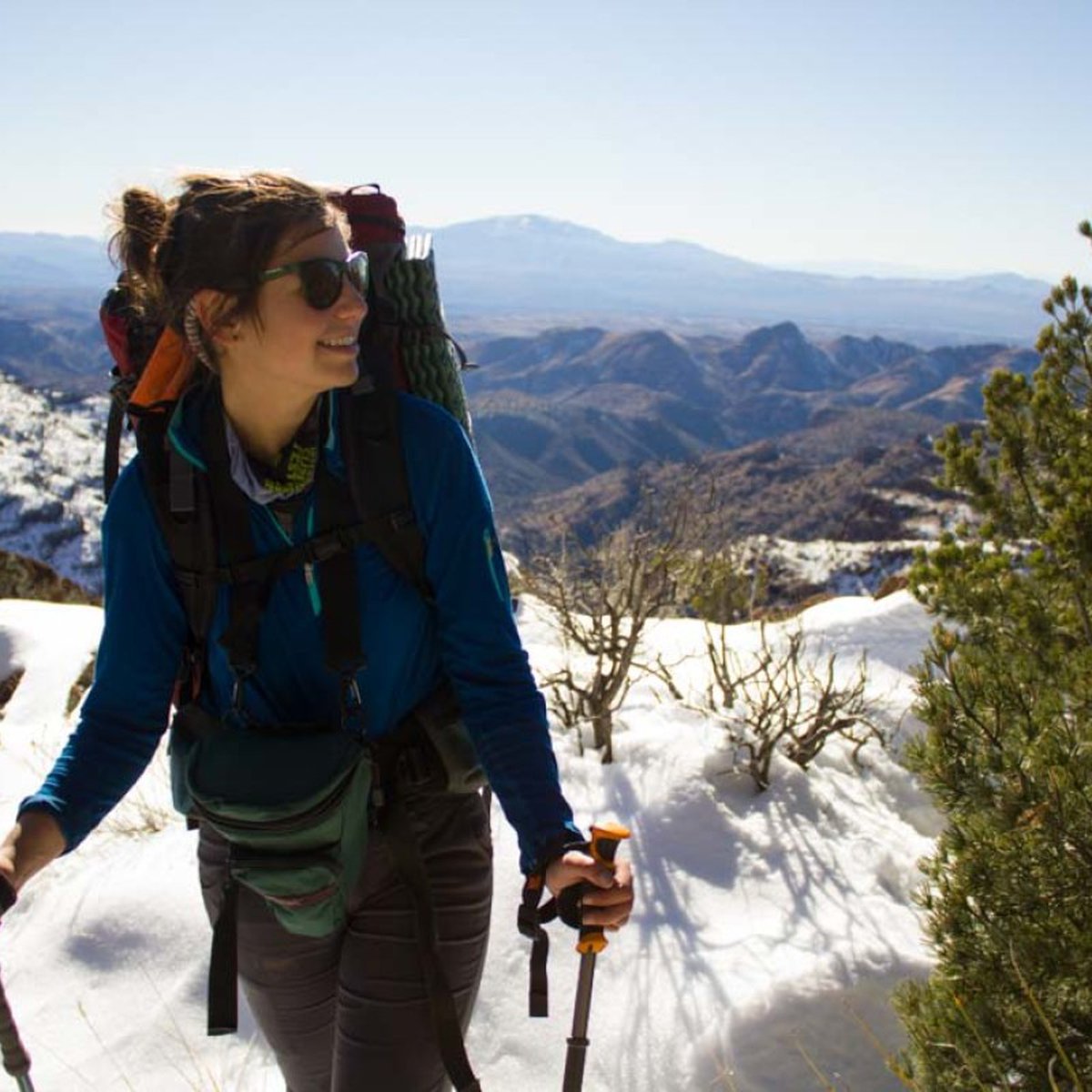 Woman hiking and smiling in the Southwest US