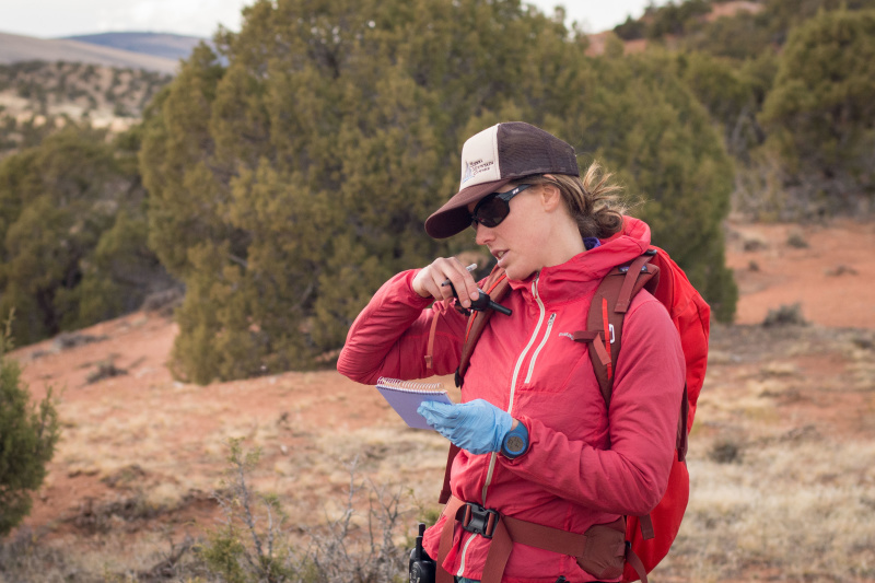 Woman talks on a walkie-talkie