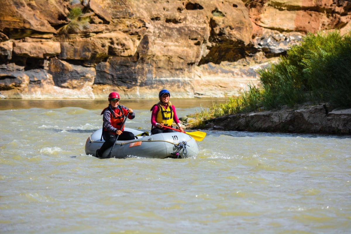 Two paddlers on a raft