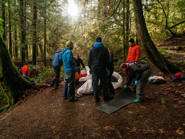 NOLS Wilderness Medicine students practice caring for a patient in the woods