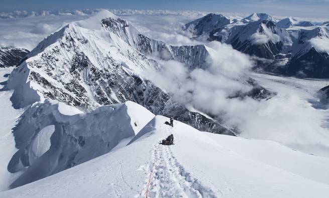 A sweeping view from above the clouds on Karsten's Ridge while mountaineering on Denali in Alaska.