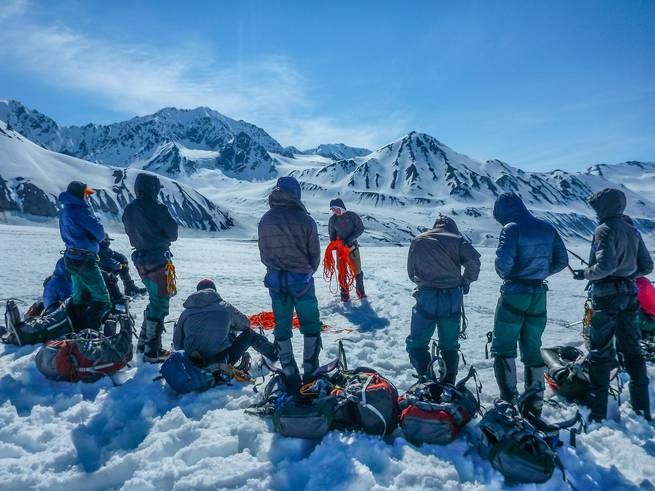 Mountaineering students circled up in Alaska.