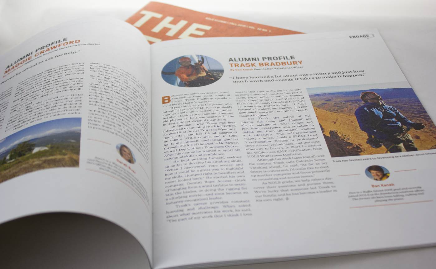 The Leader magazine laying open to a page on alumni profiles.