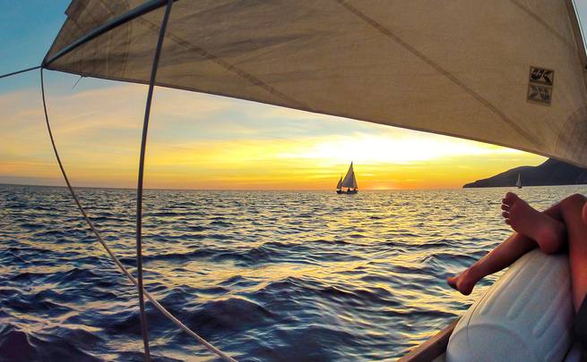 Student enjoying the brilliant sunset on the water while out sailing in Baja California, Mexico.
